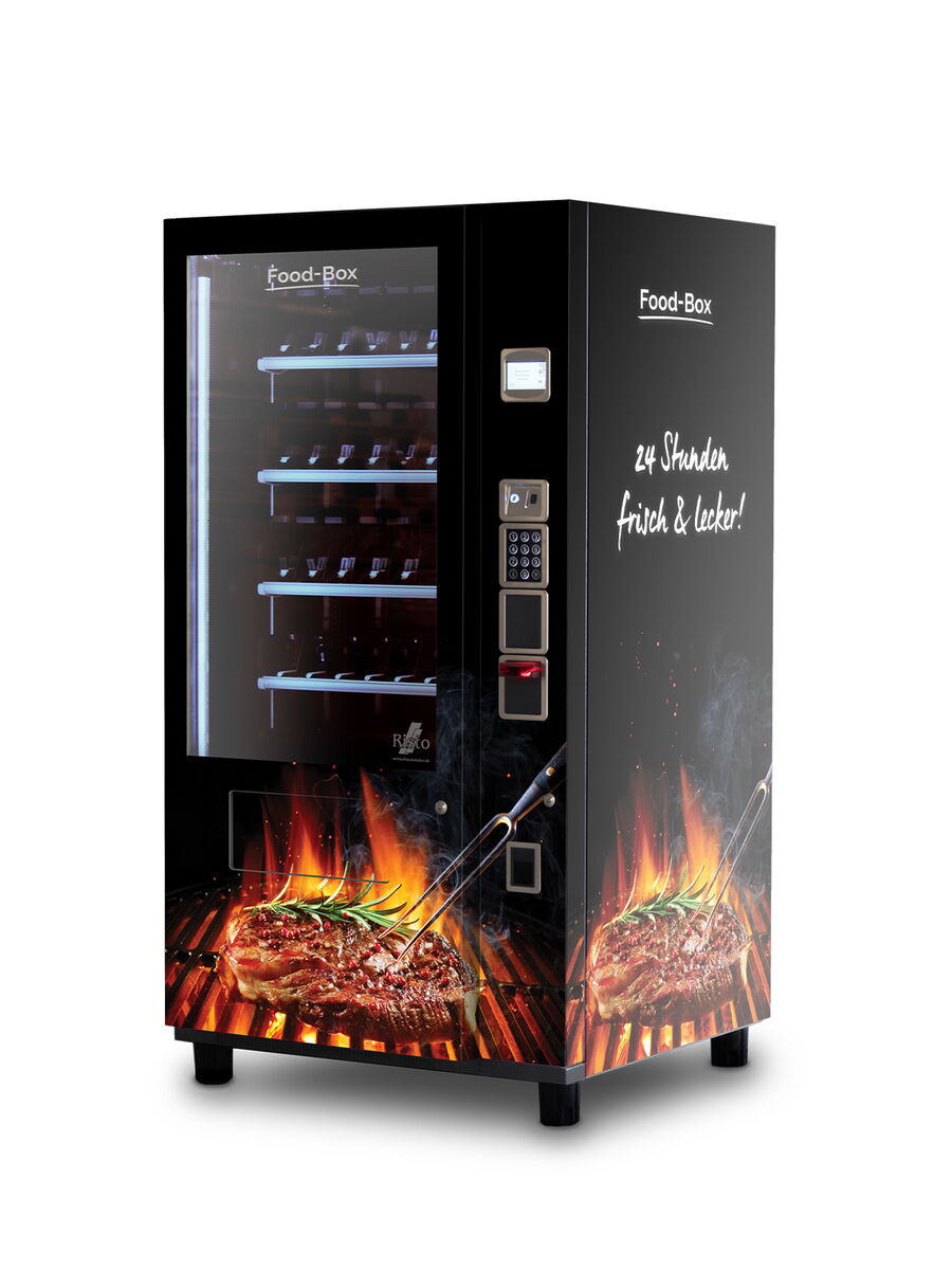 Ein Verkaufsautomat mit Grillfleischabbildungen und Text 24 Stunden frisch lecker